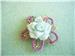 Hand Made, but petal of flower has broken. I have glued it back, not for fussy buyers. Still look perfect!